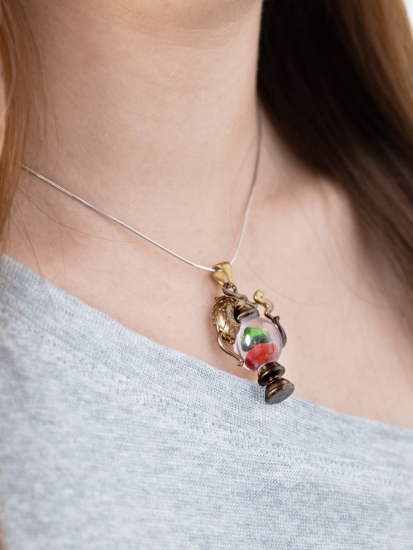 alt="Worn Dragonbrew Teapot Necklace with dragon pendant and colorful resin"