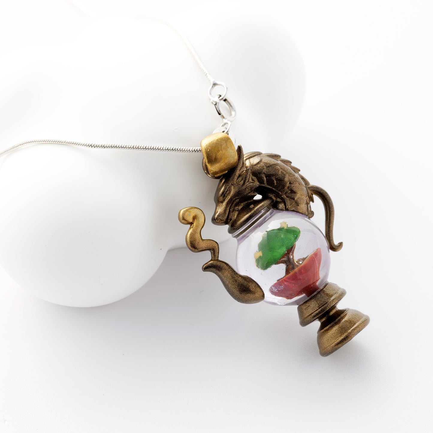 alt="Close-up of Dragonbrew Teapot Necklace showing intricate dragon and teapot details"