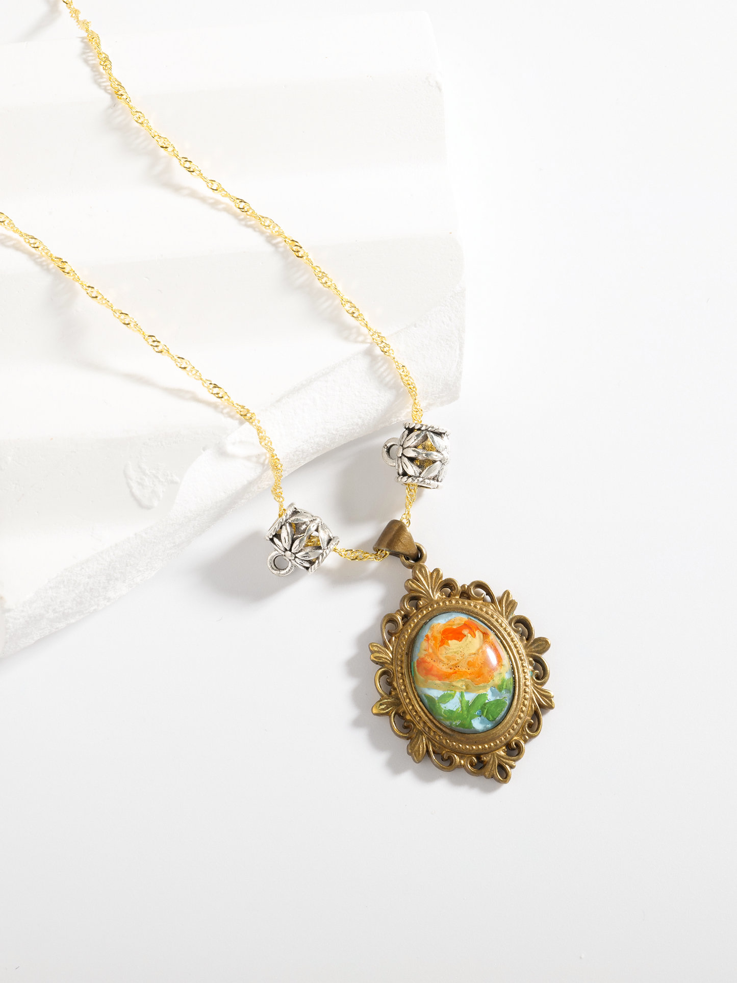 Rose in Golden Light · Hand-painted Brass Relief Floral Necklace – Vintage Sunlit Pendant for Women