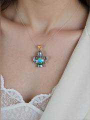 alt="Dream Distiller Necklace worn on neck with teapot pendant and resin dewdrop"