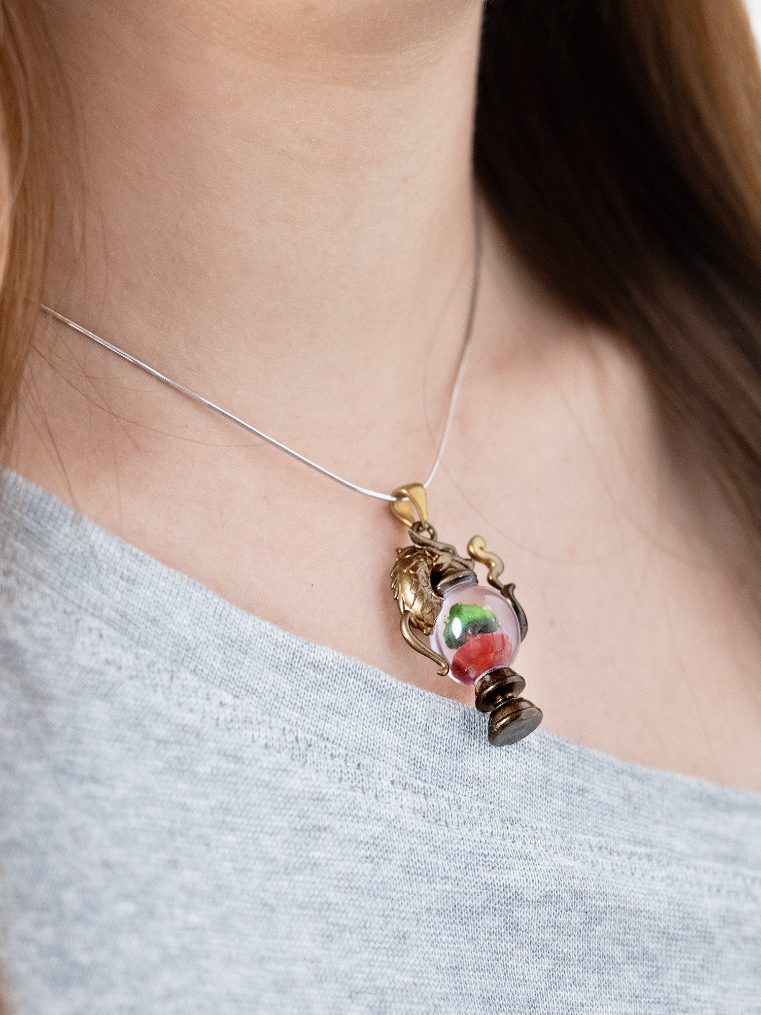 alt="Worn Dragonbrew Teapot Necklace with dragon pendant and colorful resin"