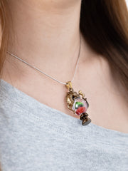alt="Worn Dragonbrew Teapot Necklace with dragon pendant and colorful resin"